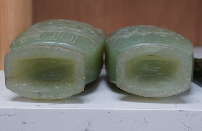 A pair of Chinese carved green quartz vases and covers, 21cm. Condition - fair, natural crack to body of one vase, chips to edges of both